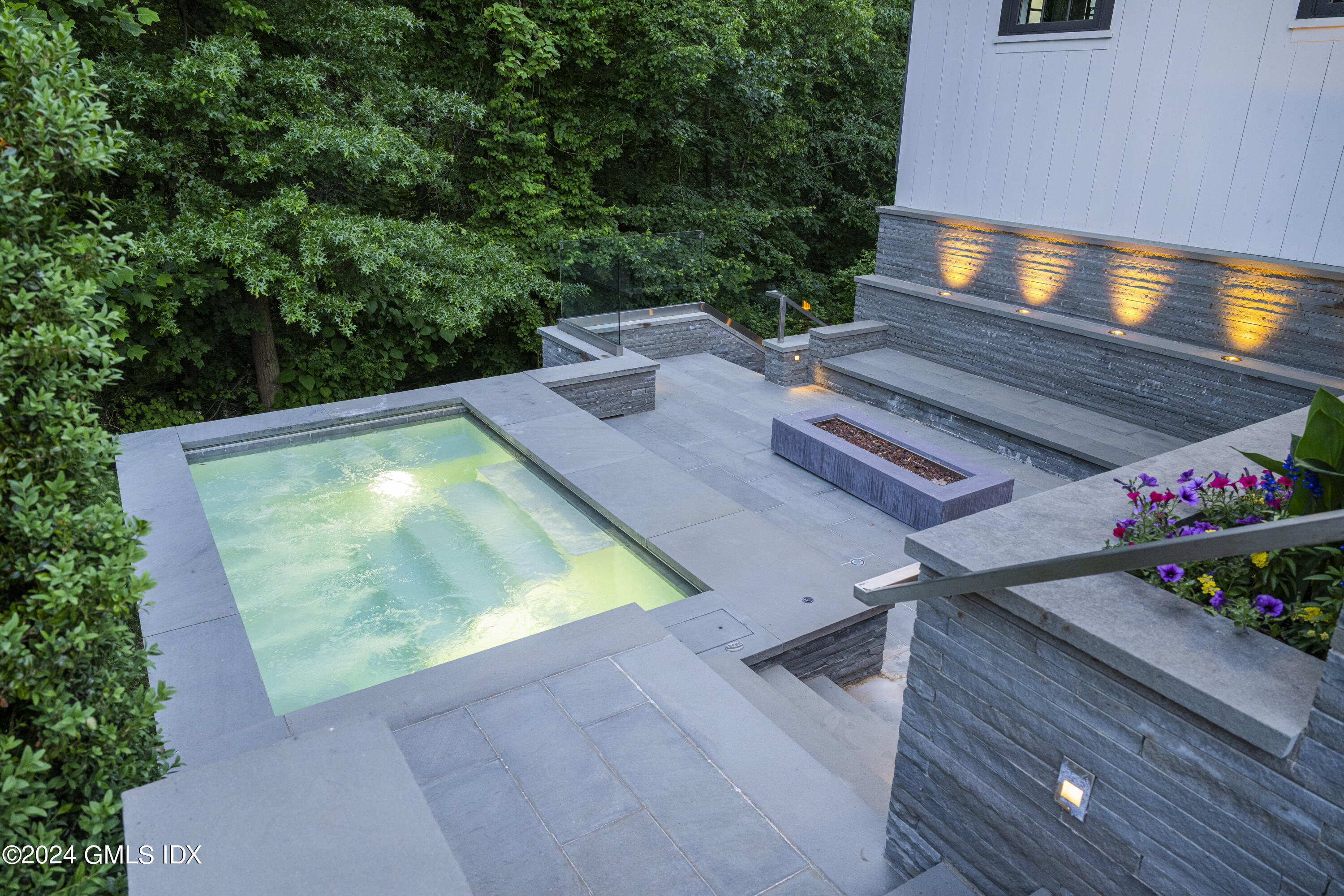 865 Hollow Tree Ridge Road Darien, CT 06820 - Photo 36 of 37 a view of a backyard with chairs and a potted plant