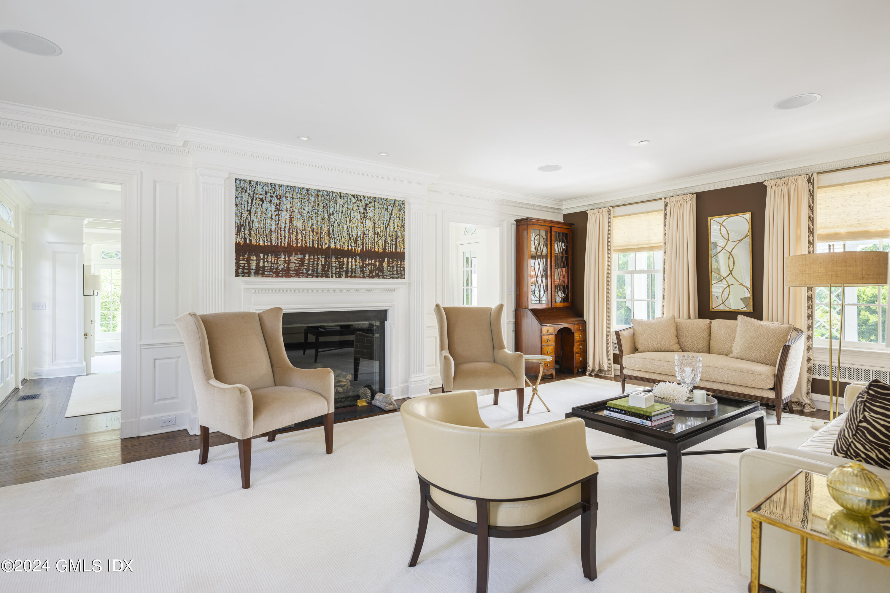 865 Hollow Tree Ridge Road Darien, CT 06820 - Photo 5 of 37 a living room with furniture and a fireplace