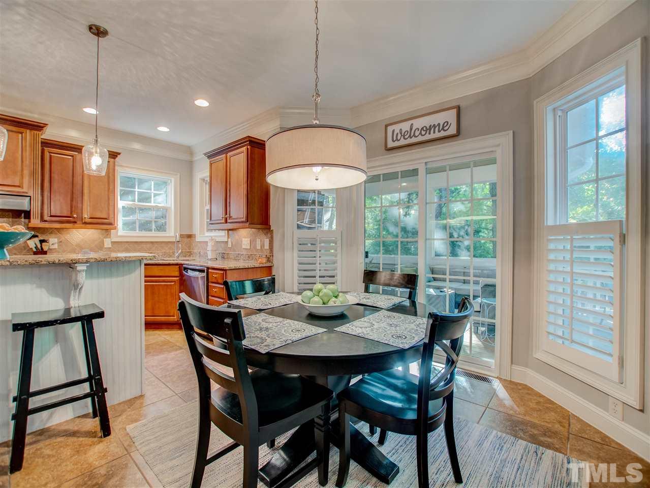 4307 Oakthorne Way Raleigh, NC 27613 - Photo 12 of 30 a view of a dining room with furniture window and outside view