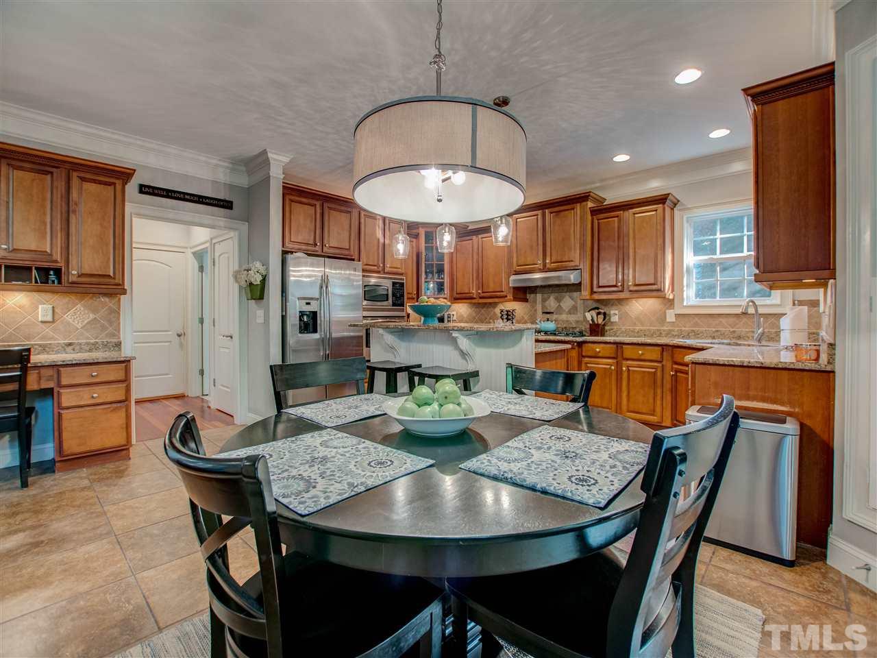 4307 Oakthorne Way Raleigh, NC 27613 - Photo 14 of 30 a view of a dining room with furniture