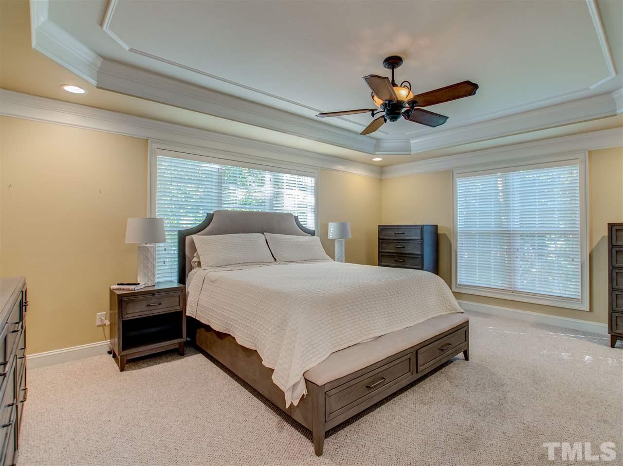 4307 Oakthorne Way Raleigh, NC 27613 - Photo 16 of 30 a spacious bedroom with a bed and window