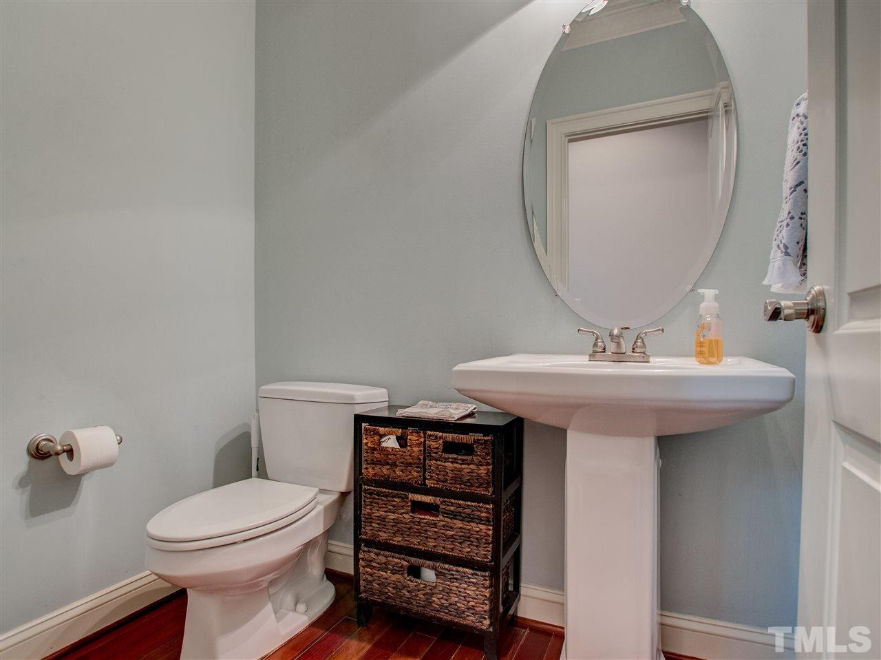 4307 Oakthorne Way Raleigh, NC 27613 - Photo 20 of 30 a bathroom with a sink a toilet and mirror