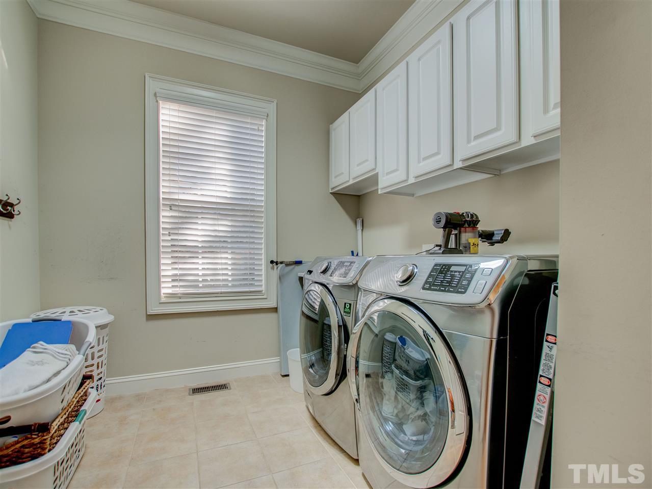 4307 Oakthorne Way Raleigh, NC 27613 - Photo 21 of 30 a utility room with sink dryer and washer