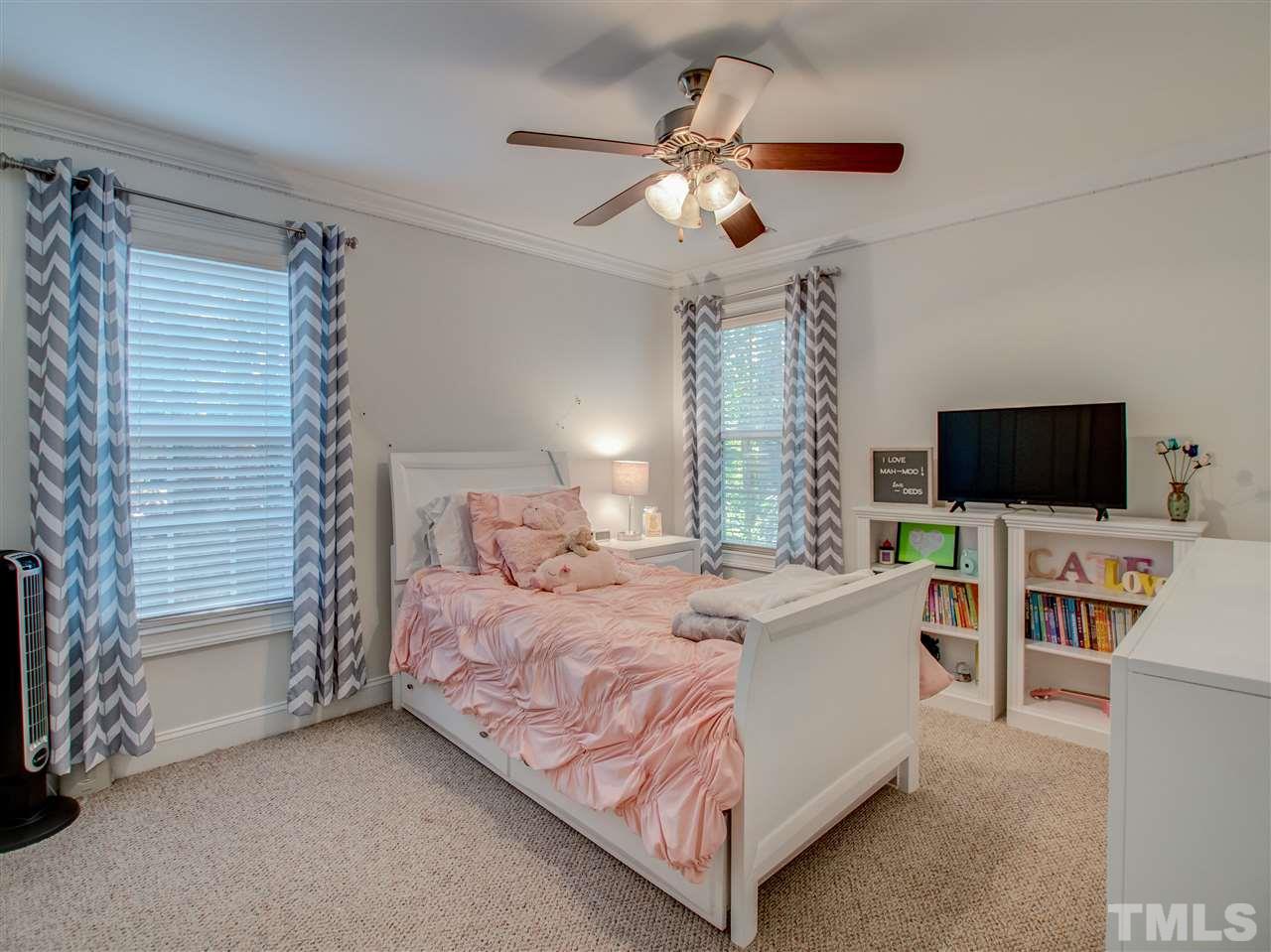 4307 Oakthorne Way Raleigh, NC 27613 - Photo 23 of 30 a bed room with a bed and television