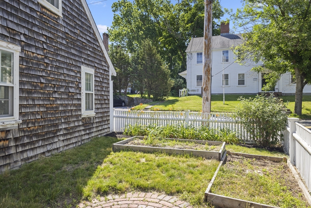 191-193 South Street, Unit 1 Hingham, MA 02043 - Photo 20 of 23 a view of a house with a yard