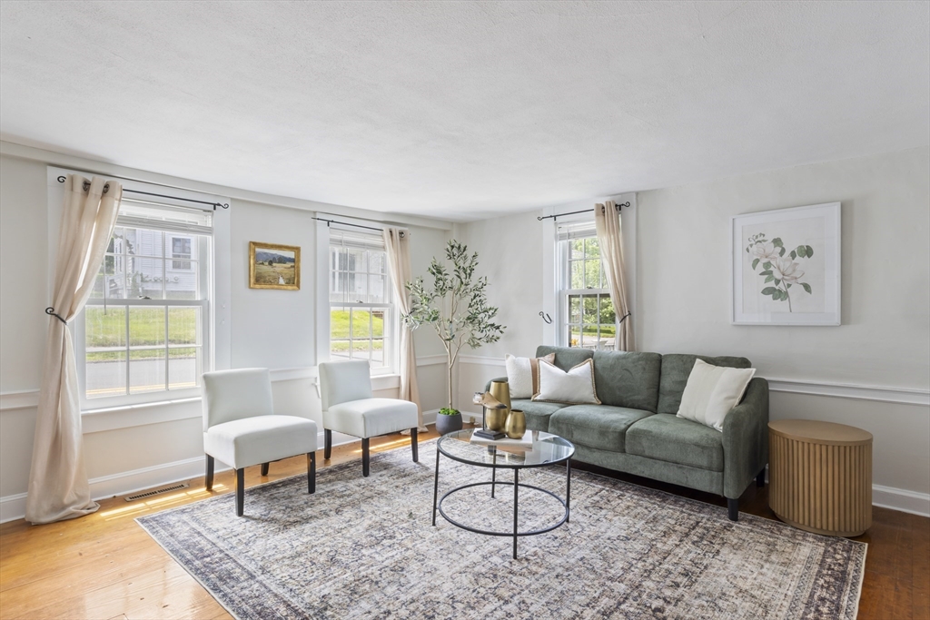 191-193 South Street, Unit 1 Hingham, MA 02043 - Photo 7 of 23 a living room with furniture and a window with wooden floor