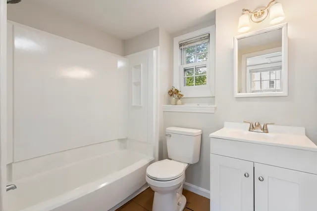 a bathroom with a sink toilet and vanity