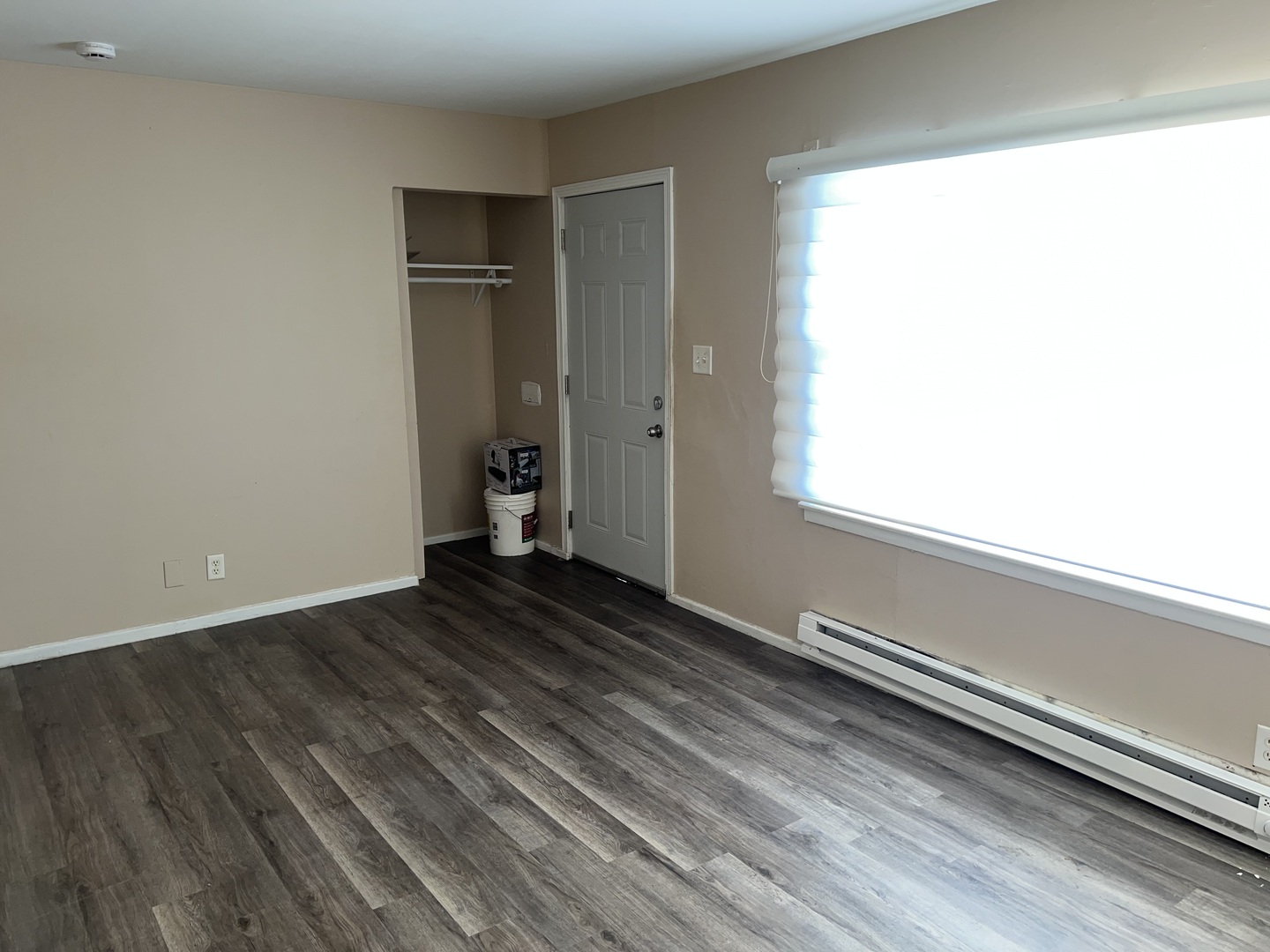 1184 East Merchant Street, Unit 213 Kankakee, IL 60901 - Photo 2 of 6 a view of a room with wooden floor and window