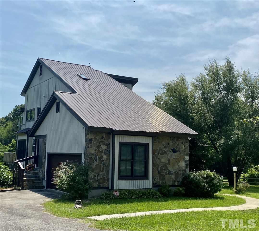 8235 Springhill Church Road Lucama, NC 27851 - Photo 2 of 30 a front view of a house with garden