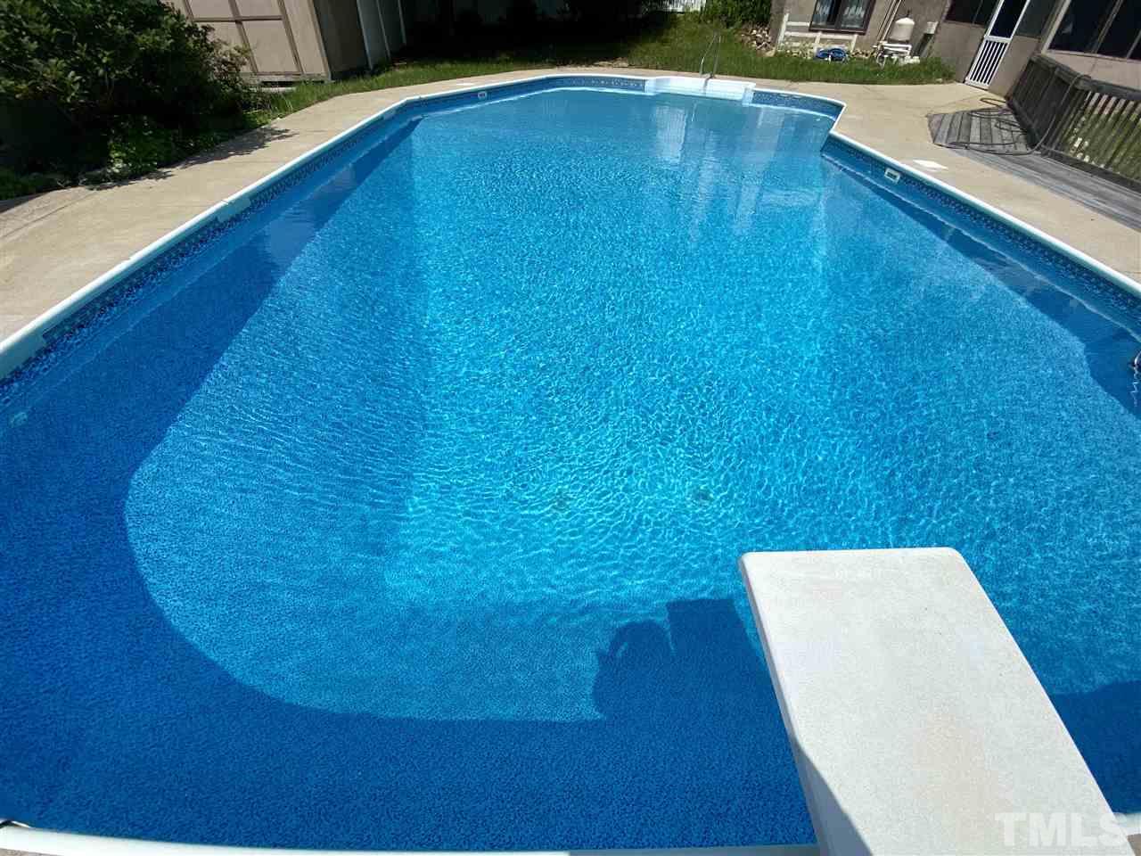 8235 Springhill Church Road Lucama, NC 27851 - Photo 13 of 30 a view of a swimming pool with an outdoor space