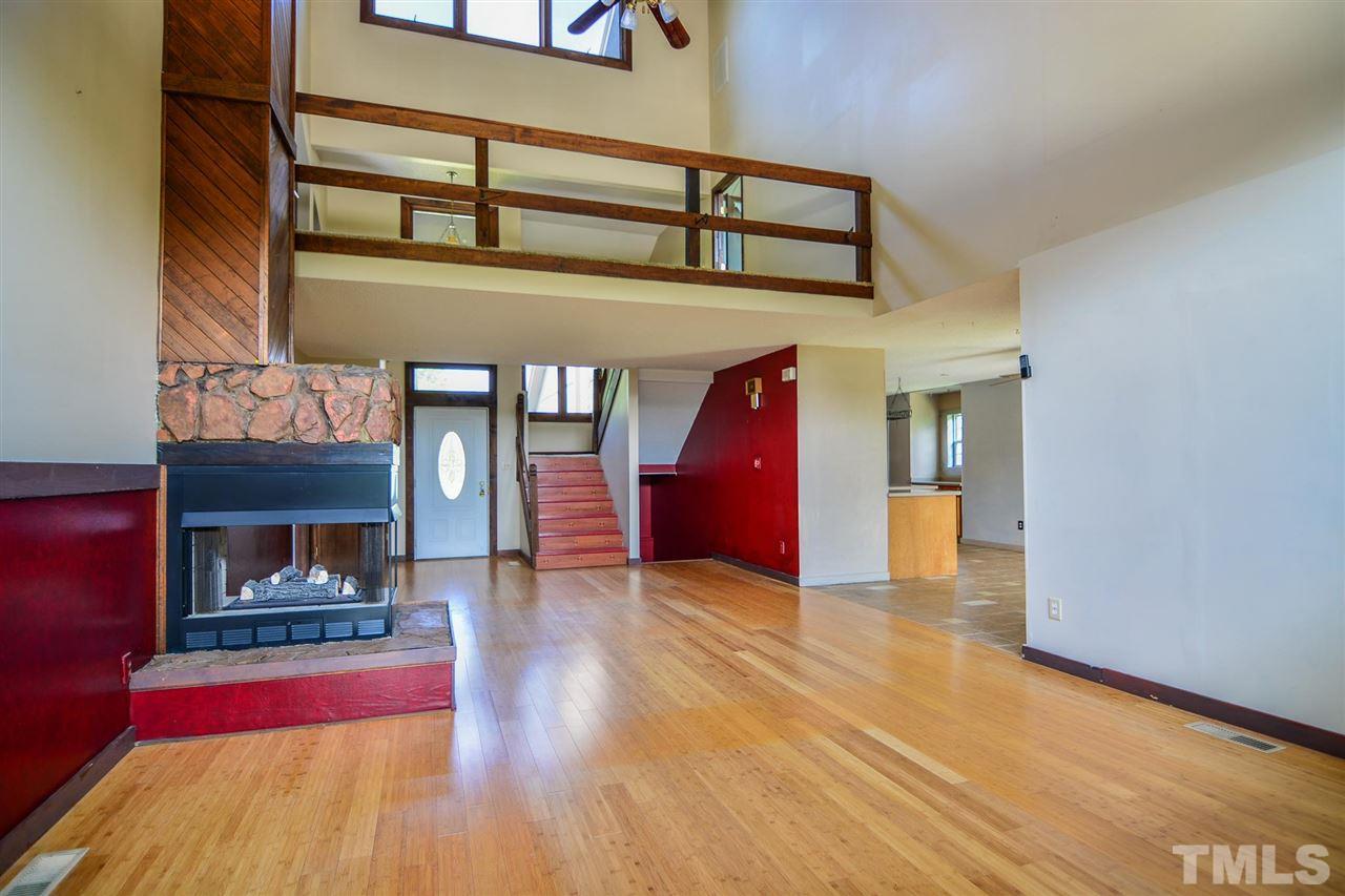 8235 Springhill Church Road Lucama, NC 27851 - Photo 22 of 30 a view of living room with furniture and fireplace