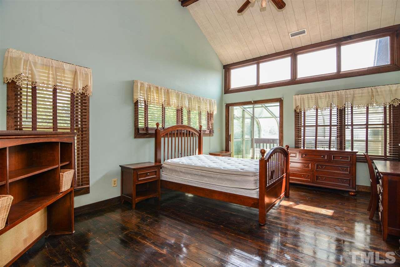8235 Springhill Church Road Lucama, NC 27851 - Photo 27 of 30 a bedroom with furniture and a window
