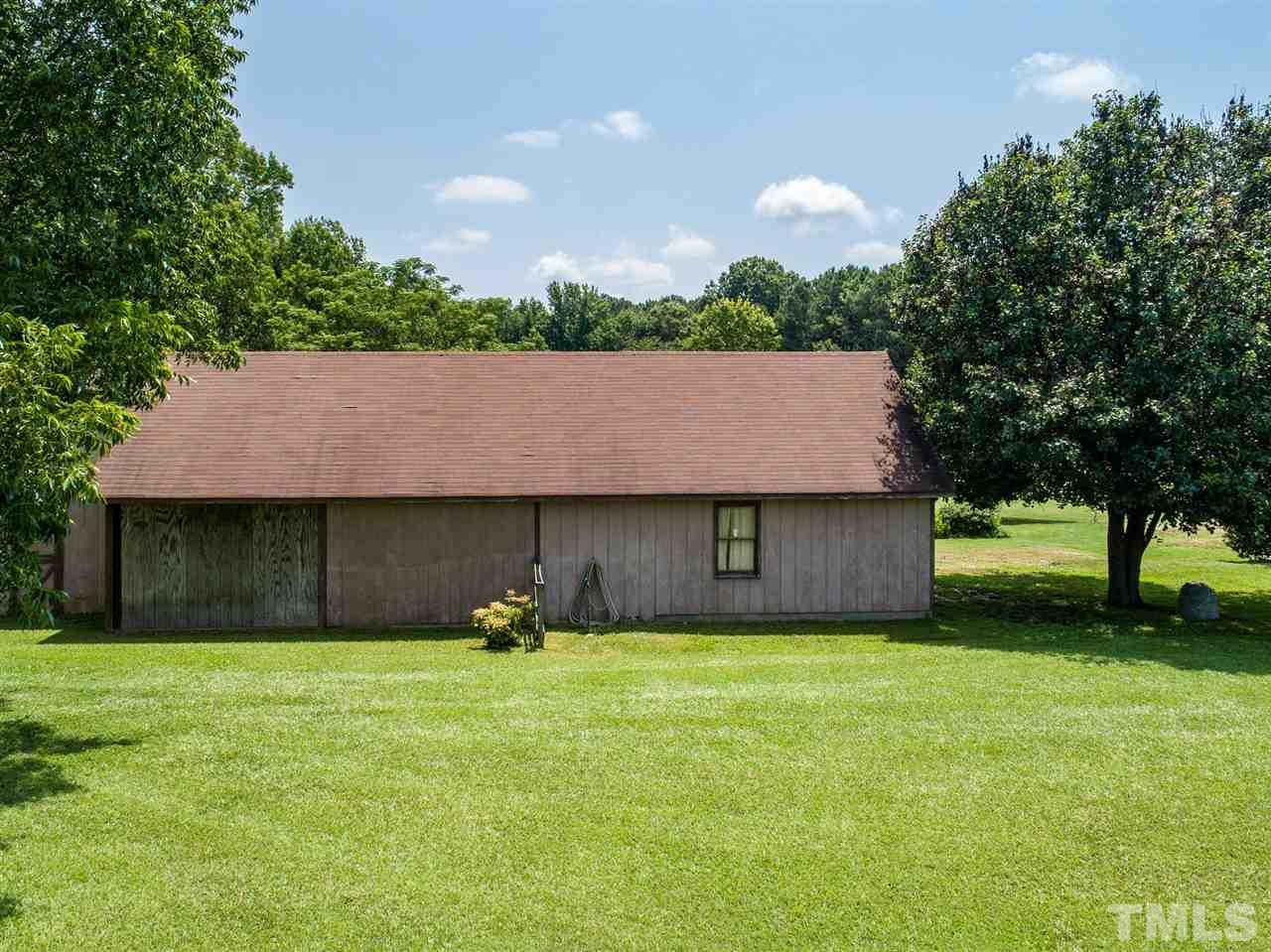 8235 Springhill Church Road Lucama, NC 27851 - Photo 28 of 30 a house view with a garden space