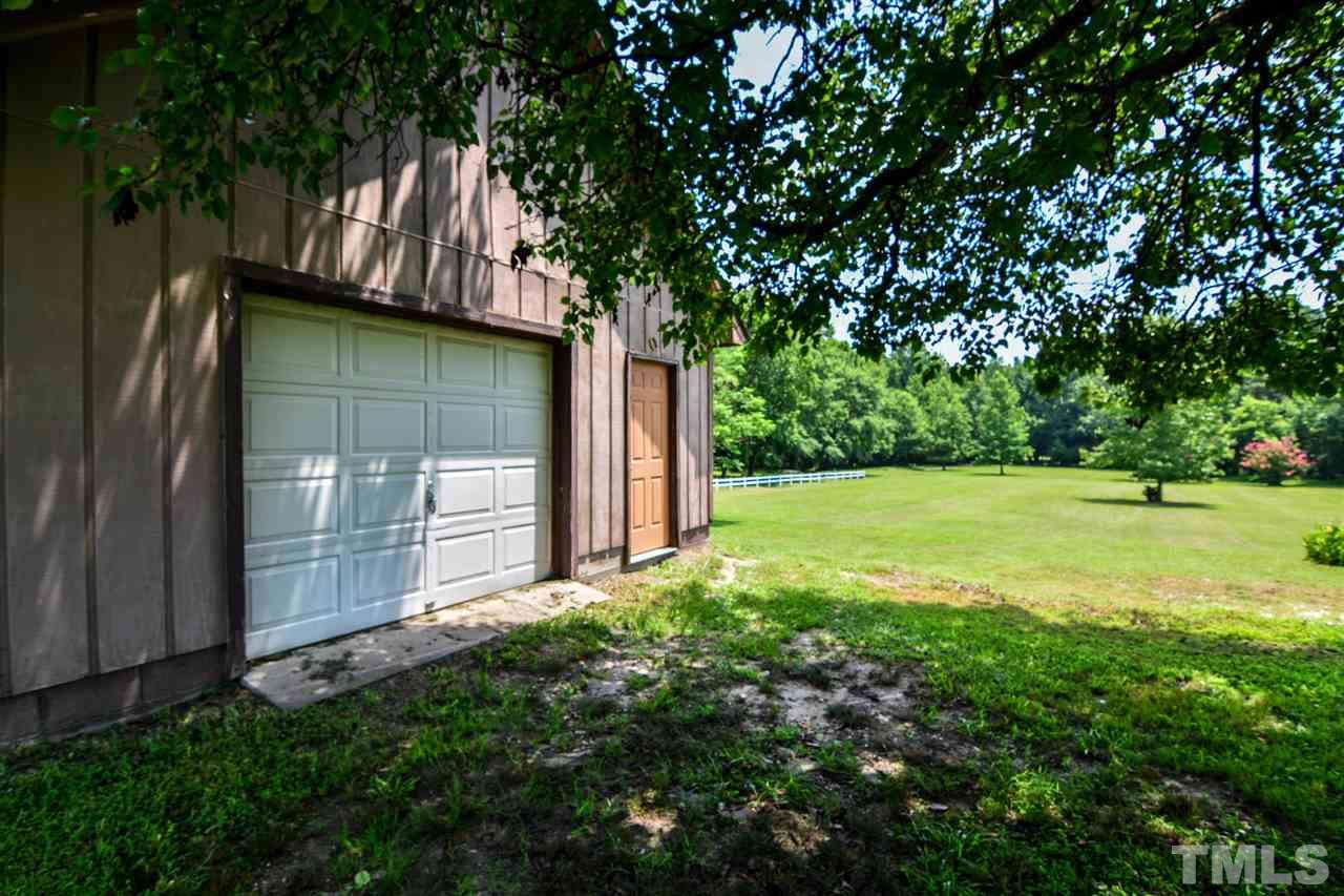 8235 Springhill Church Road Lucama, NC 27851 - Photo 29 of 30 a backyard of a house with lots of green space