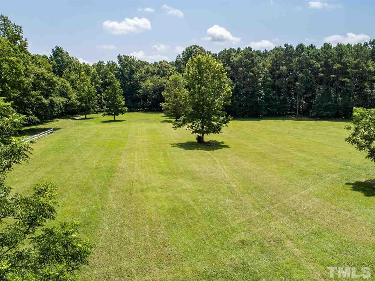 8235 Springhill Church Road Lucama, NC 27851 - Photo 30 of 30 a view of a yard with an outdoor space