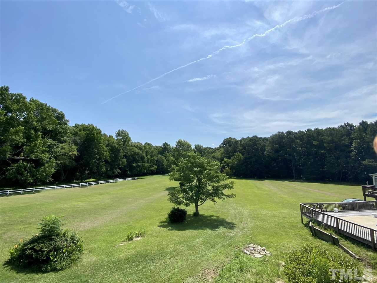 8235 Springhill Church Road Lucama, NC 27851 - Photo 7 of 30 a view of a lake with a yard