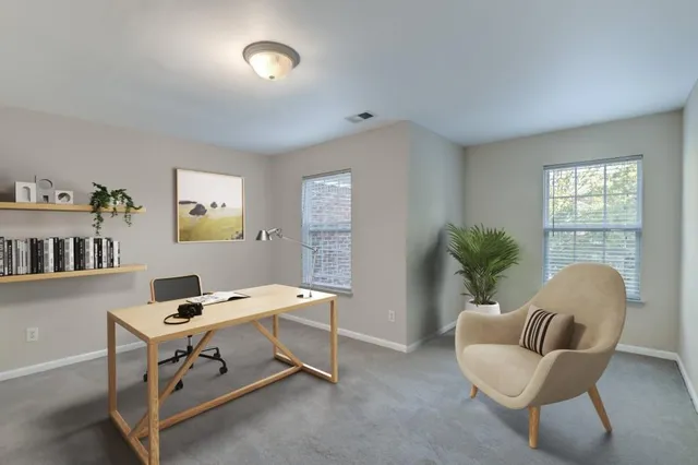 a workspace with furniture and window