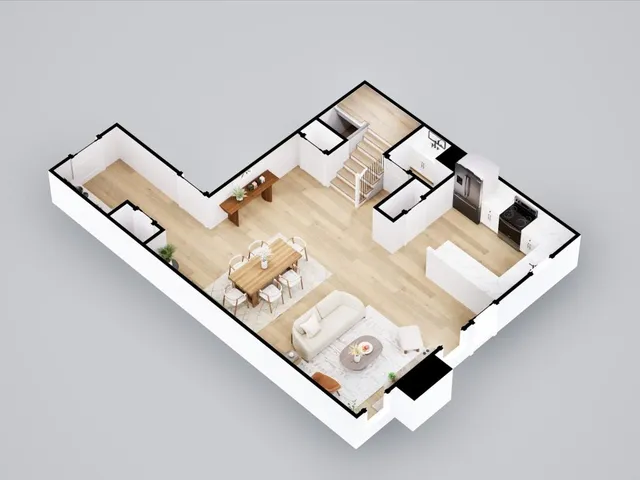 an aerial view of a couch in wooden floor