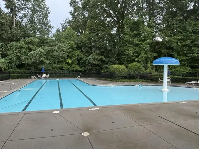 a view of a backyard with under an umbrella
