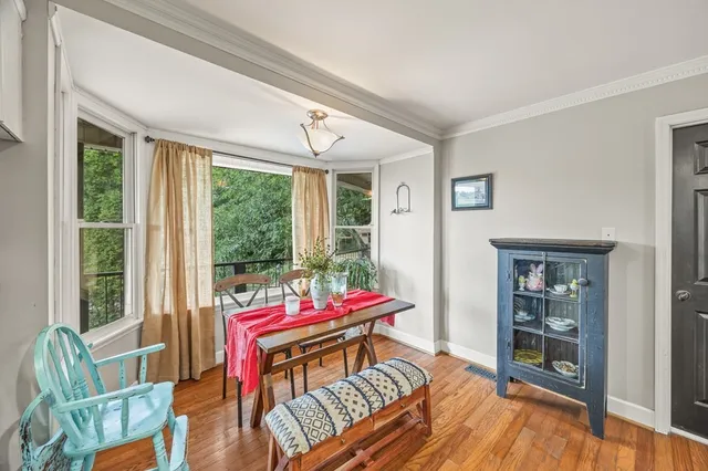a living room with furniture and large windows
