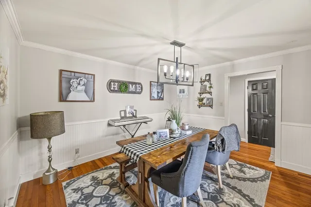 a workspace with furniture and chandelier
