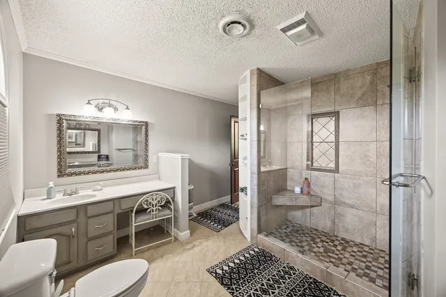 a bathroom with a toilet a sink and a mirror