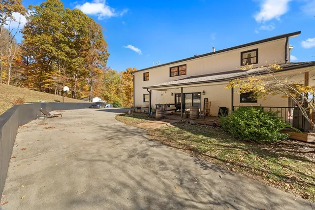 a very nice looking house with large windows