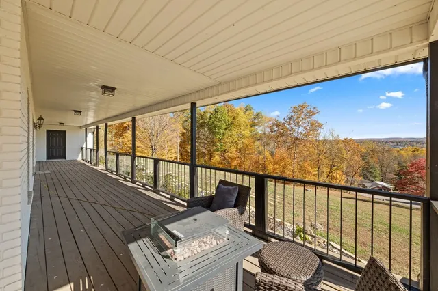 a balcony with wooden floor