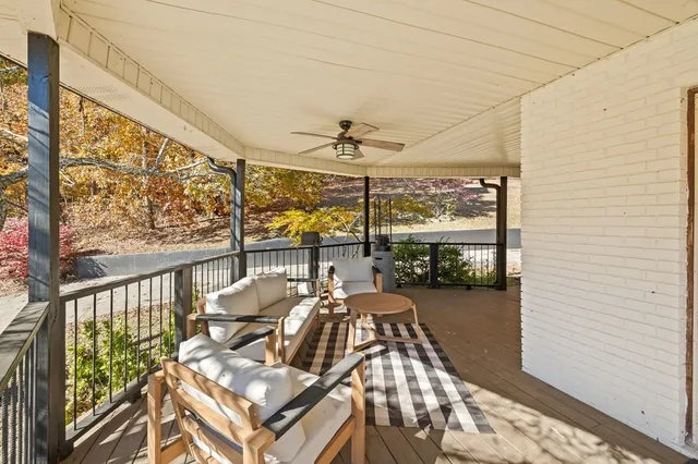 a view of a balcony with furniture