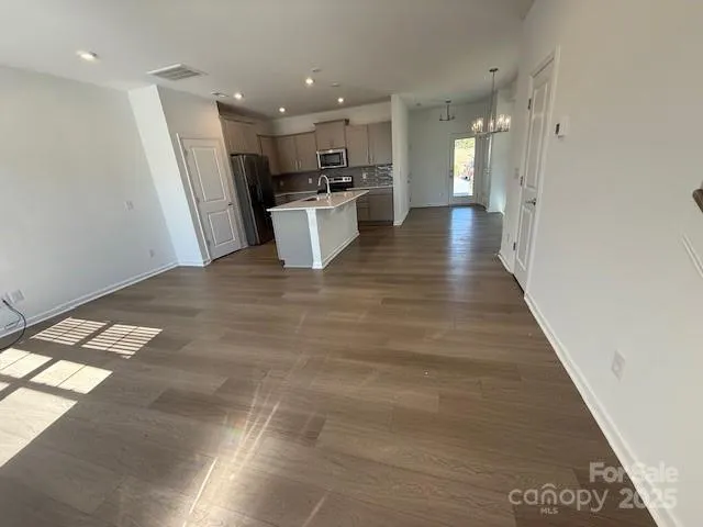a view of a kitchen with a sink