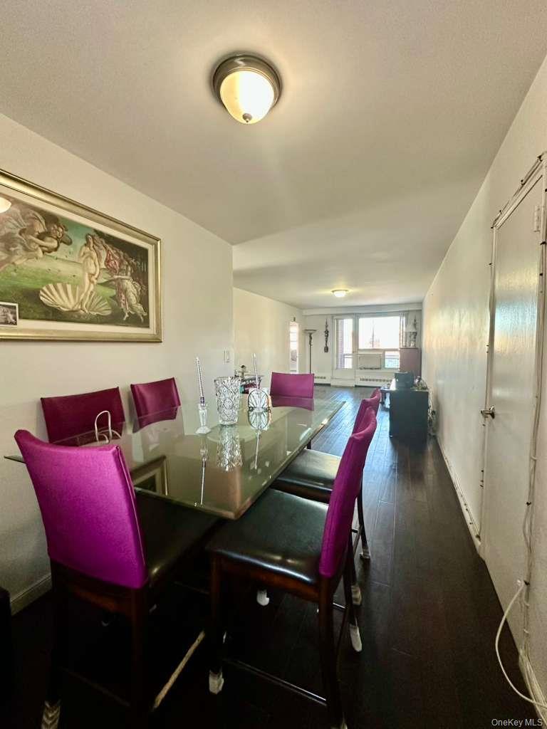 97-07 63rd Road, Unit 6H Queens, NY 11374 - Photo 3 of 17 a view of a dining room with furniture