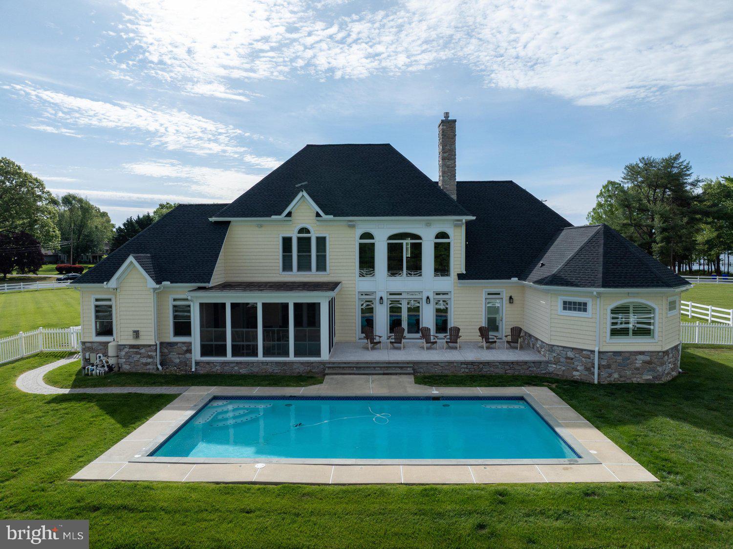 313 Wye Road Queenstown, MD 21658 - Photo 5 of 132 Elegant home with pool and lush surroundings.