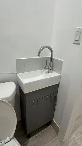 a bathroom with a sink and a toilet