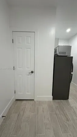 an empty room with wooden floor