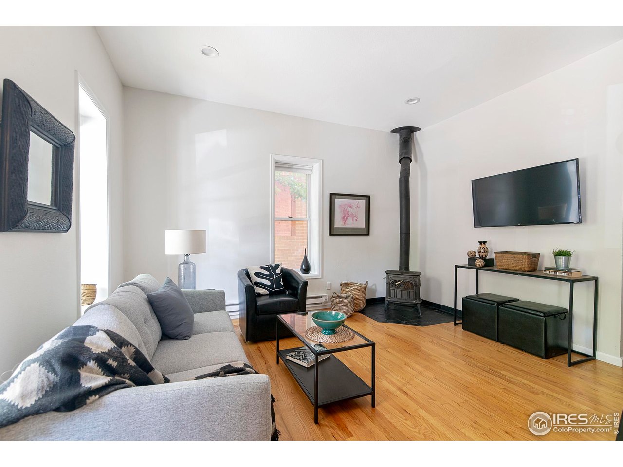 1237 Elder Avenue, Unit 1 Boulder, CO 80304 - Photo 7 of 16 Great room with wood stove