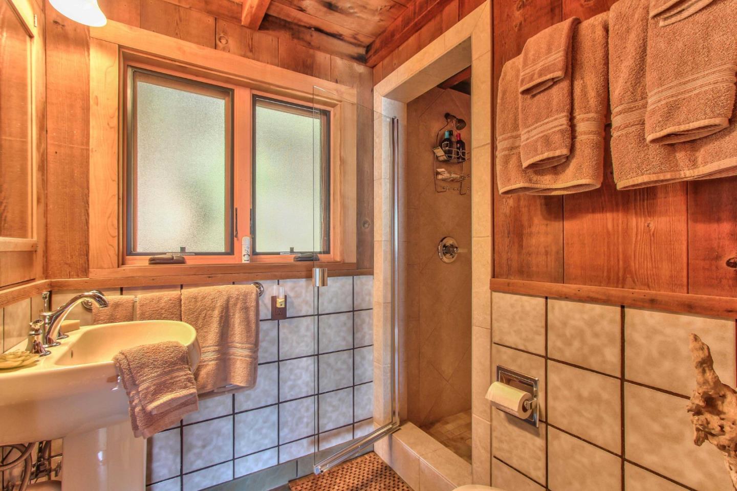 51410 Partington Ridge Road Big Sur, CA 93920 - Photo 20 of 45 a bathroom with a bathtub and shower