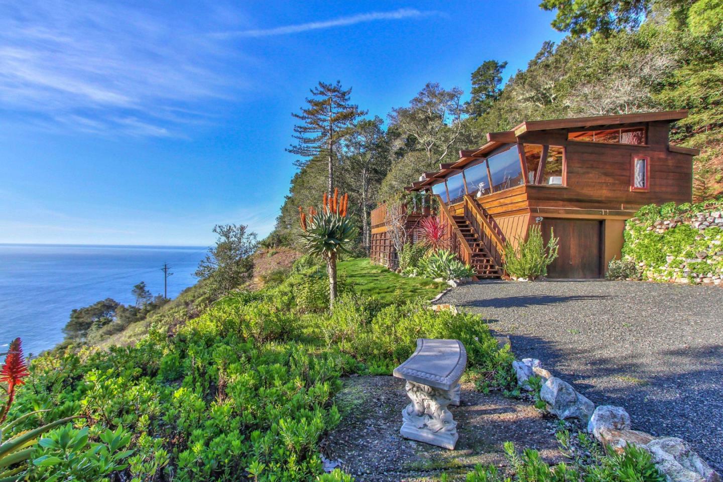 51410 Partington Ridge Road Big Sur, CA 93920 - Photo 2 of 45 a front view of a house with a yard