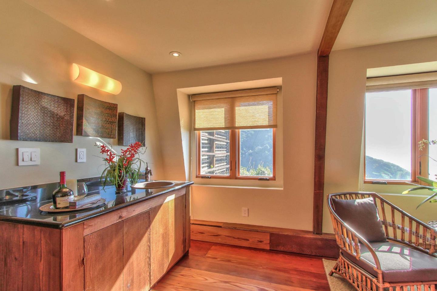 51410 Partington Ridge Road Big Sur, CA 93920 - Photo 26 of 45 a spacious bathroom with stainless steel appliances a sink and a large mirror