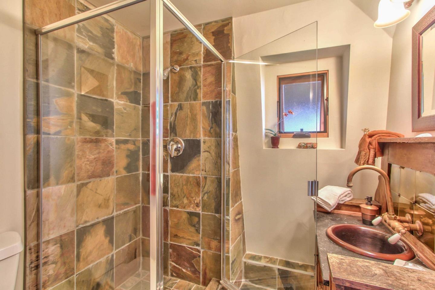 51410 Partington Ridge Road Big Sur, CA 93920 - Photo 27 of 45 a bathroom with a sink and a shower