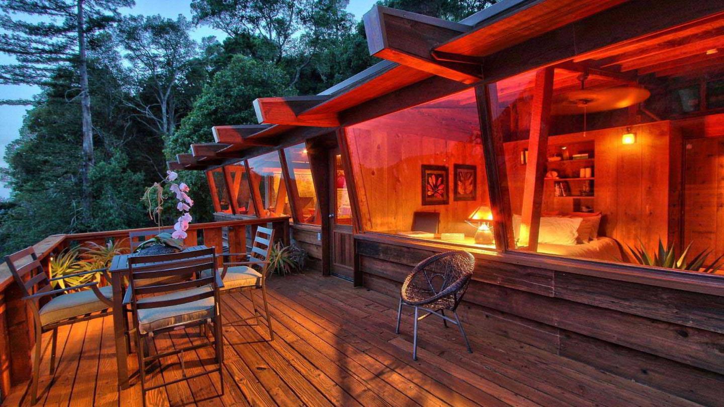 51410 Partington Ridge Road Big Sur, CA 93920 - Photo 29 of 45 a backyard of a house with barbeque oven table and chairs