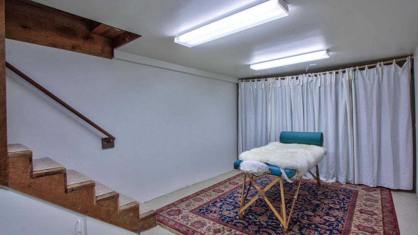 51410 Partington Ridge Road Big Sur, CA 93920 - Photo 30 of 45 a view of a hallway with chairs and a table in a room