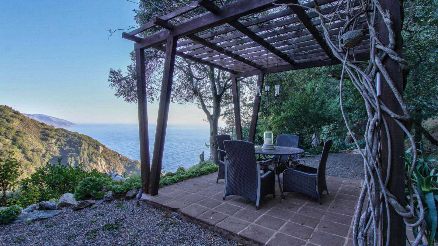 51410 Partington Ridge Road Big Sur, CA 93920 - Photo 34 of 45 a view of a backyard with sitting area