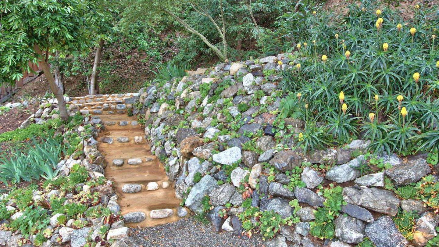 51410 Partington Ridge Road Big Sur, CA 93920 - Photo 35 of 45 a backyard of a house with lots of green space