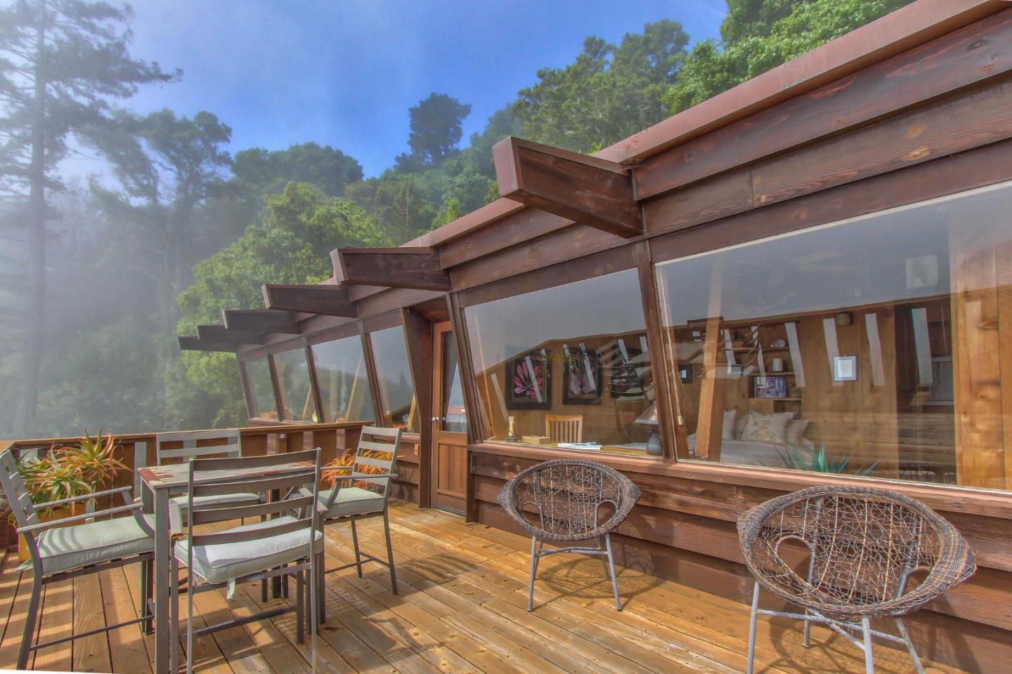 51410 Partington Ridge Road Big Sur, CA 93920 - Photo 4 of 45 a patio with a yard table and chairs