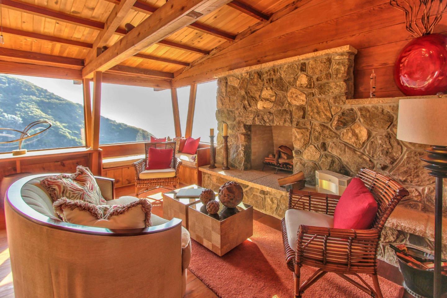 51410 Partington Ridge Road Big Sur, CA 93920 - Photo 5 of 45 a living room with furniture and a floor to ceiling window