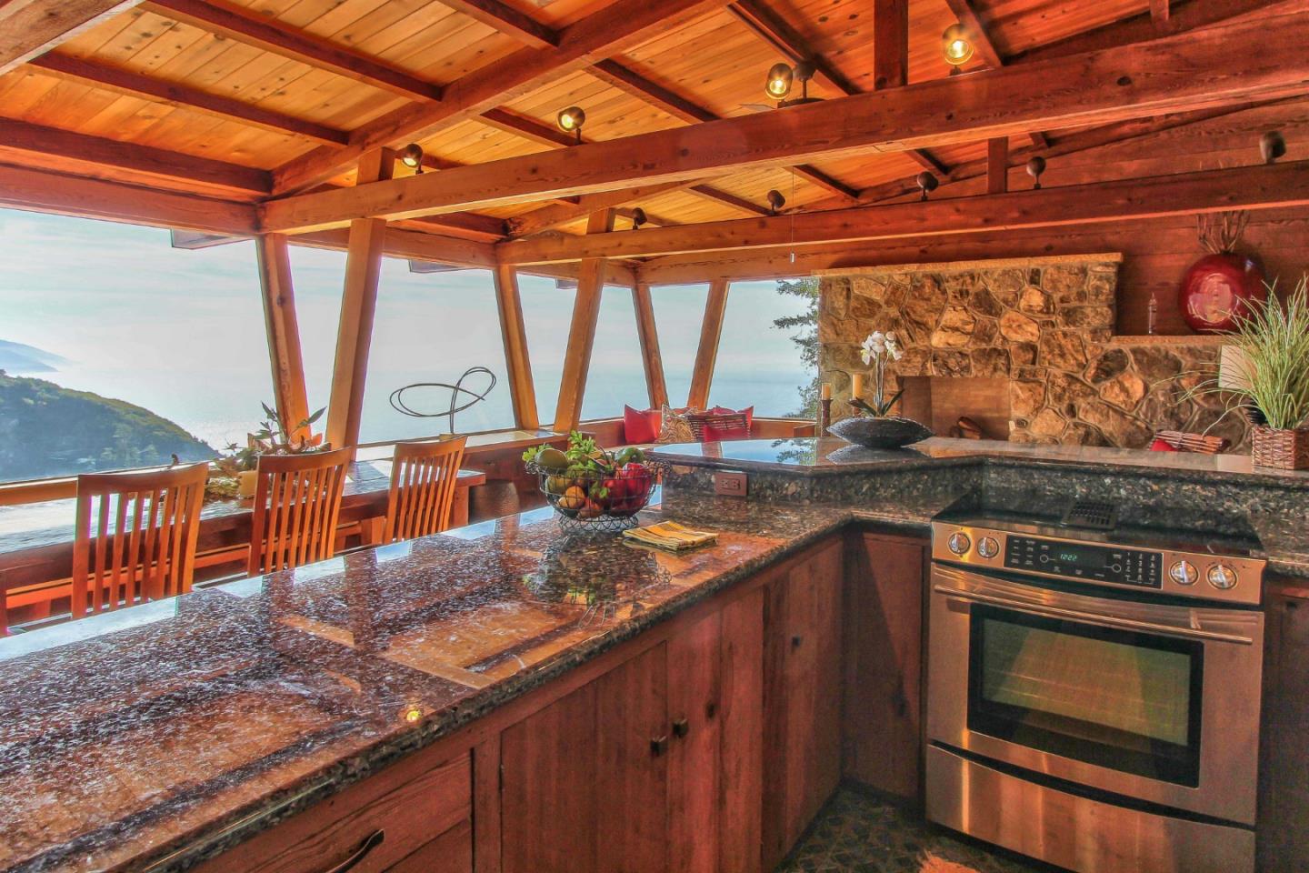 51410 Partington Ridge Road Big Sur, CA 93920 - Photo 9 of 45 a kitchen with stainless steel appliances granite countertop a stove a sink and a microwave