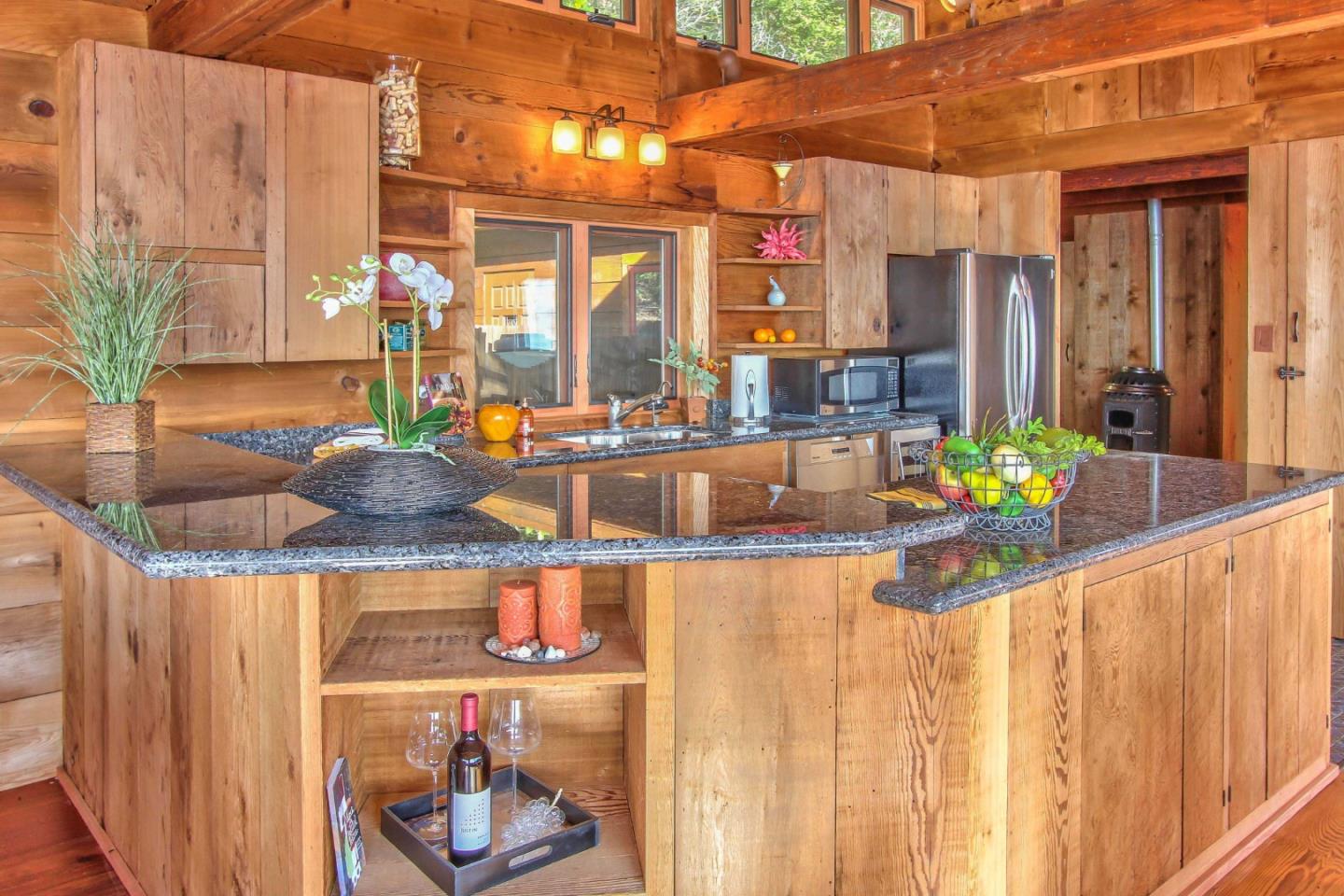 51410 Partington Ridge Road Big Sur, CA 93920 - Photo 10 of 45 a dining table with chairs and potted plant