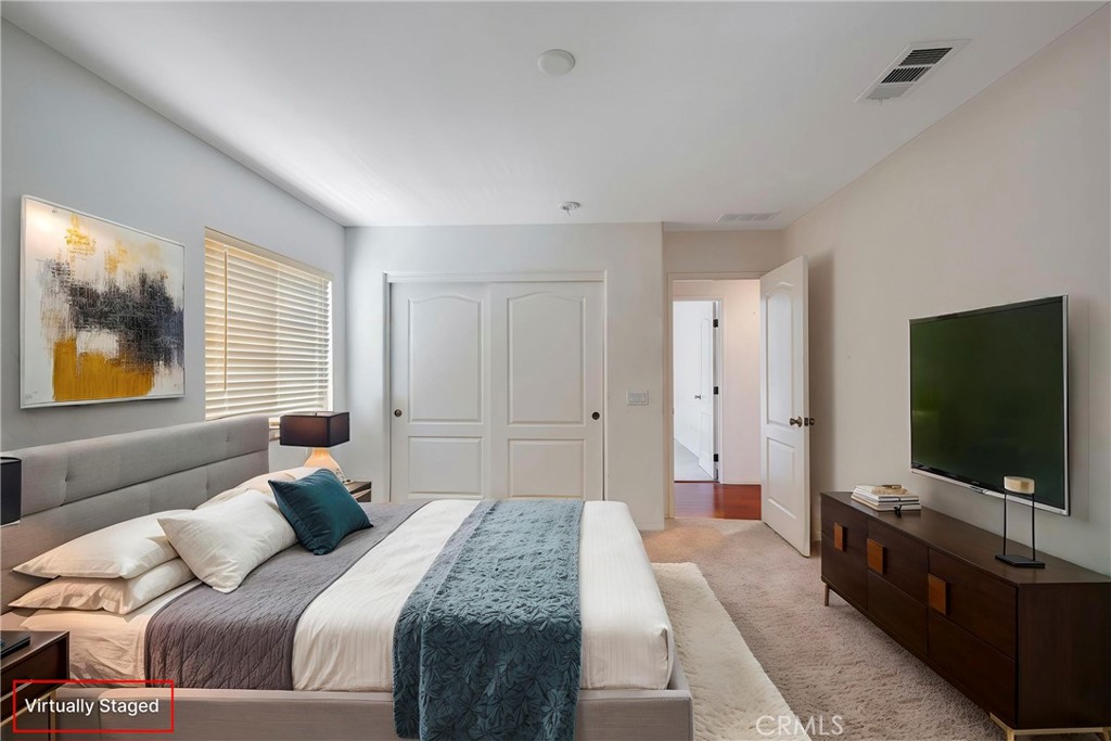 3819 St Austell Way Perris, CA 92571 - Photo 34 of 64 a bedroom with a bed and a flat screen tv