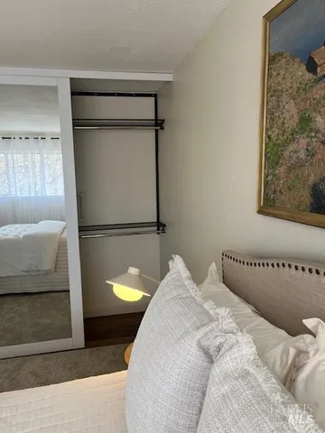 a bedroom with a bed and a couch