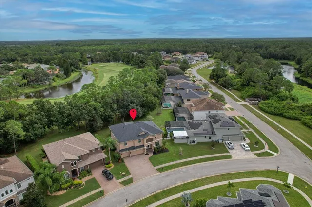an aerial view of a house with outdoor space